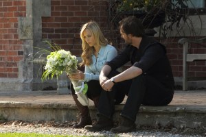 Elena (Laura Vandervoort) receives some flowers but from whom? Jeremy (Greg Bryk) is probably wondering the same thing