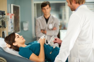 Maggie (Julia Taylor Ross) and Gavin (Kristopher Turner) get an ultrasound of their baby under the care of Dr. Calfous (Eric Johnson)