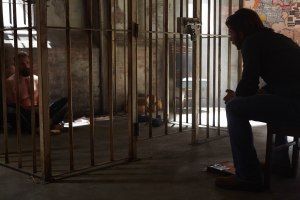 Clay (Greyston Holt ) interrogates Zachary Cain (Noah Danby)