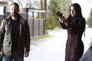 John Doe (Ryan Robbins) and Kiera (Rachel Nichols) getting ready for a showdown