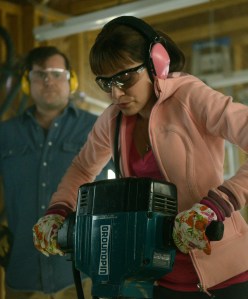Donnie (Kristian Bruun) watches as Alison (Tatiana Maslany) takes a jack hammer to the floor (perhaps to bury Dr. Leekie?)