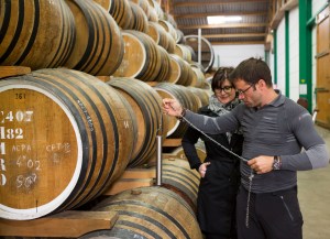 Pierre-in-barrel-room-at-Calvados-Boulard-taking-a-sample