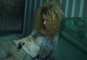 Tatiana Maslany as Helena and her scorpion friend