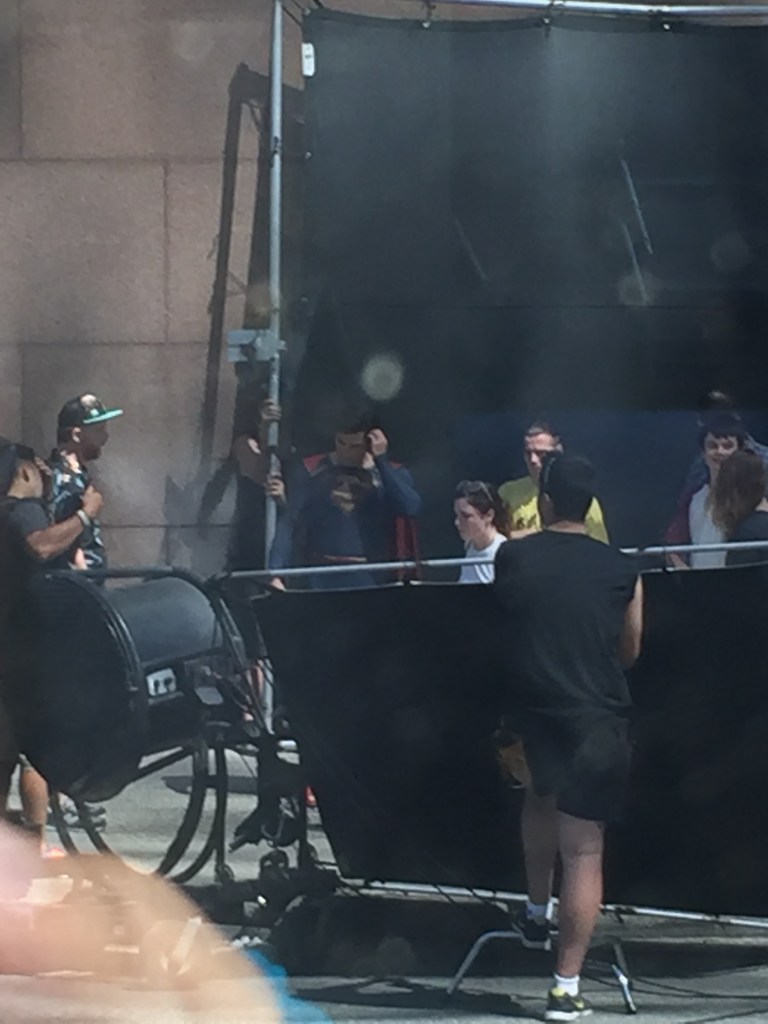 A behind the scenes shot of Superman saving the family