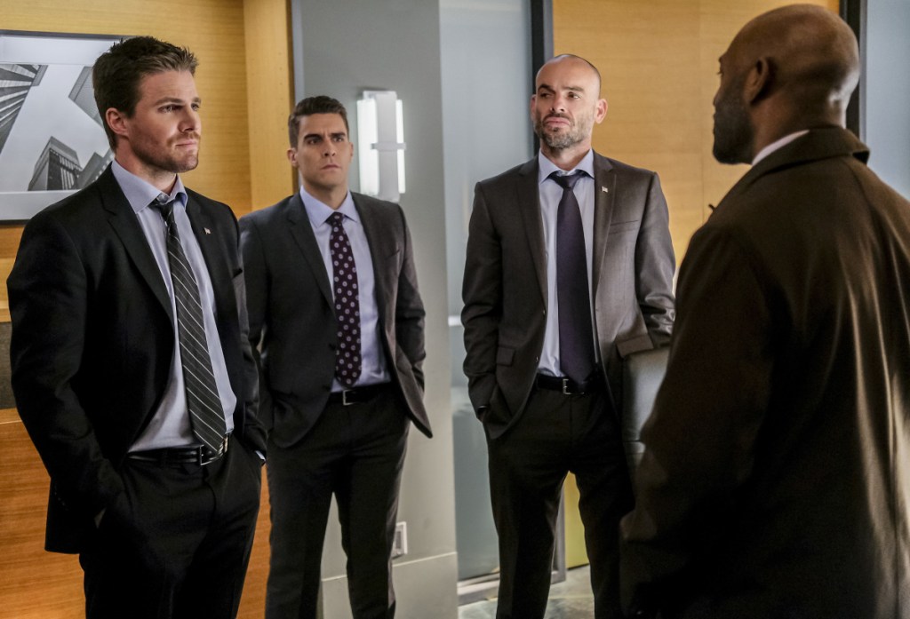 Arrow -- "The Sin-Eater" -- Image AR514a_0083b.jpg -- Pictured (L-R): Stephen Amell as Oliver Queen, Josh Segarra as Adrian Chase, Paul Blackthorne as Quentin Lance and Adrian Holmes as Captain Frank Pike -- Photo: Robert Falconer/The CW -- ÃÂ© 2017 The CW Network, LLC. All Rights Reserved.
